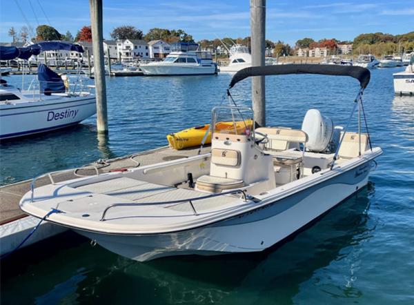 Carolina Skiff 19 LS 2022 Carolina Skiff 19 LS boat docked in a marina with other vessels.