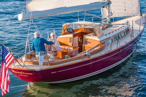 Morris M42 Sailing on a 2011 Morris M42 yacht with American flag, two people onboard.