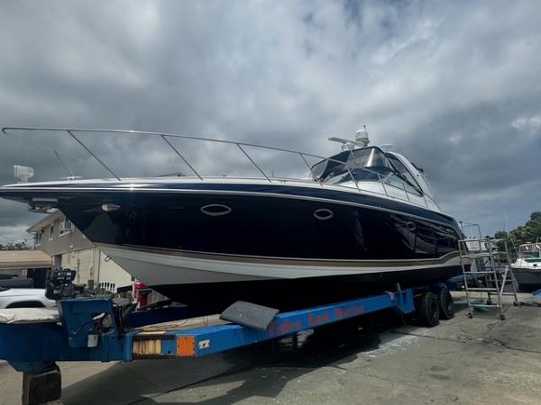 Formula 40pc 2013 Formula 40pc yacht on trailer under cloudy sky.