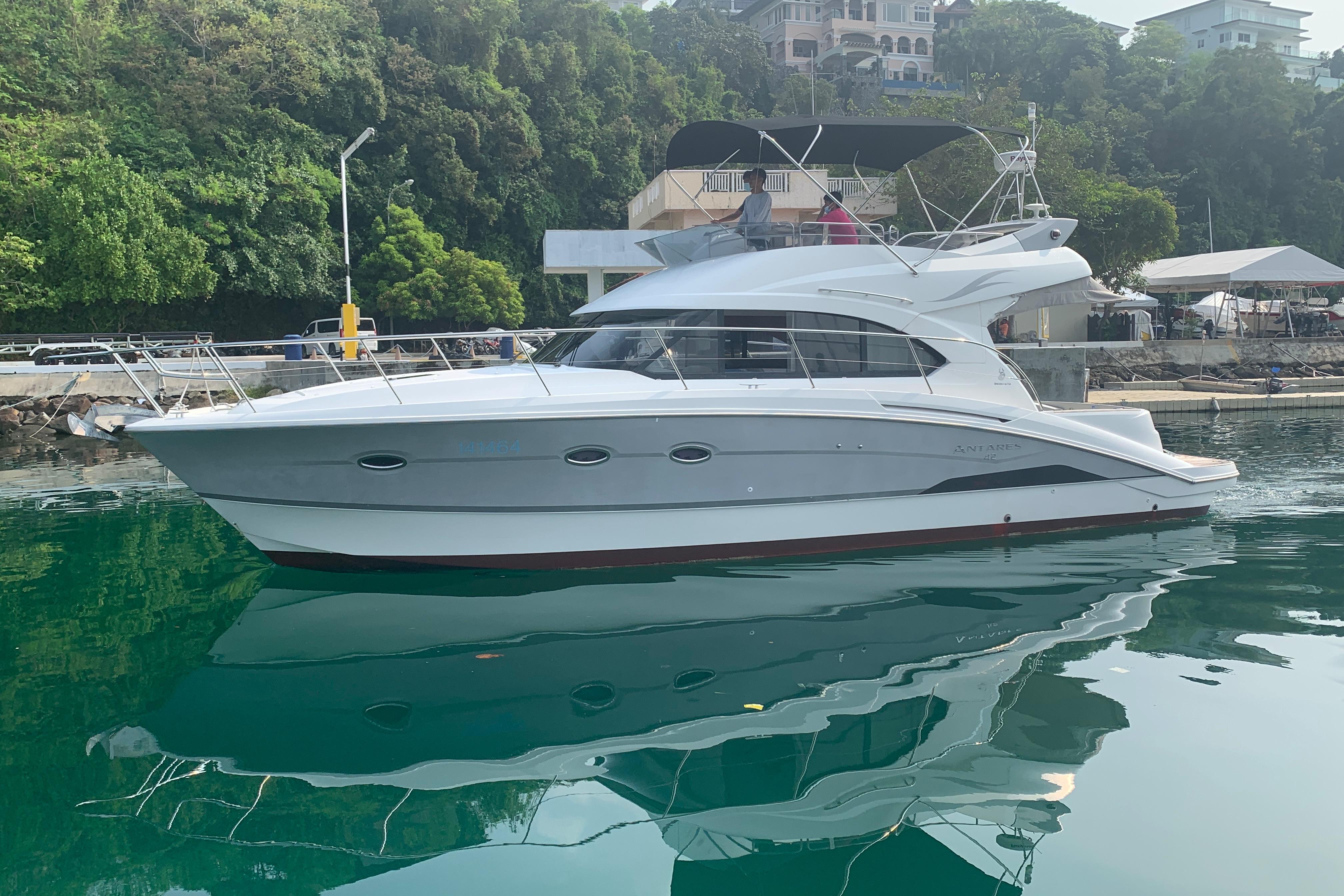Beneteau Antares 42 2014 Beneteau Antares 42 yacht docked in a serene marina setting.