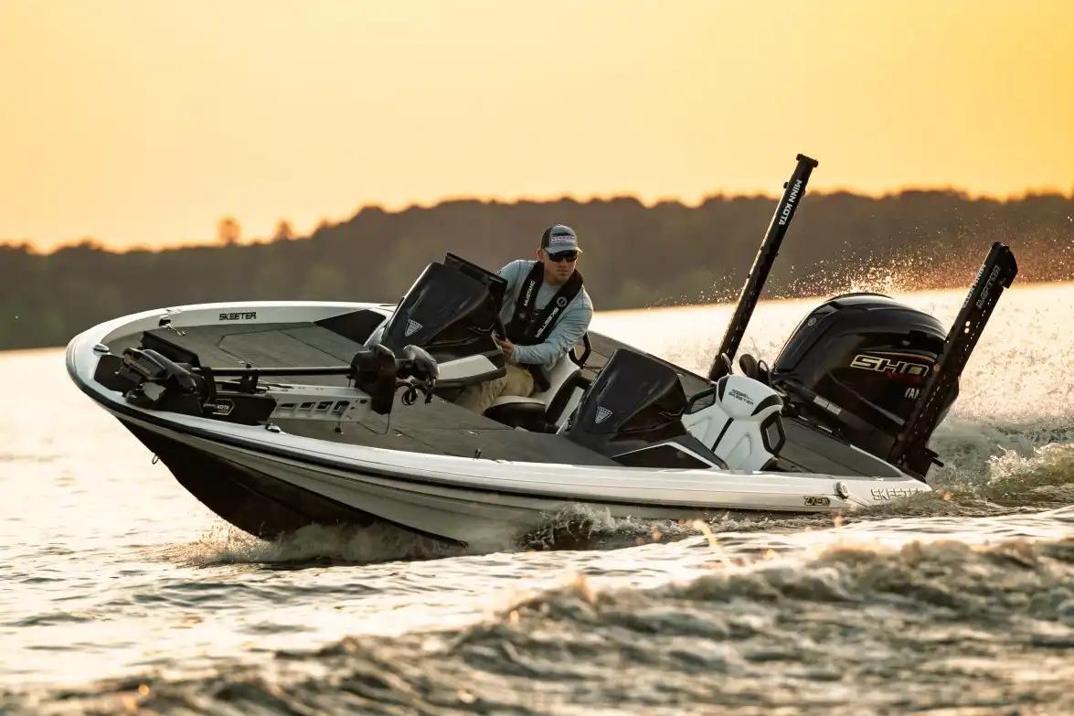 Skeeter ZXE21 Manufacturer Provided Image: 2026 Skeeter ZXE21 boat cruising on a lake at sunset.
