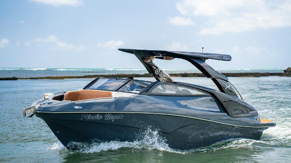 NX Boats NX 280 XTREME 2025 NX Boats NX 280 XTREME cruising on water, sleek design, sunny day.