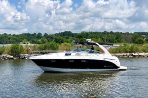 Chaparral 330 Signature 2007 Chaparral 330 Signature boat cruising on a scenic lake under a cloudy sky.