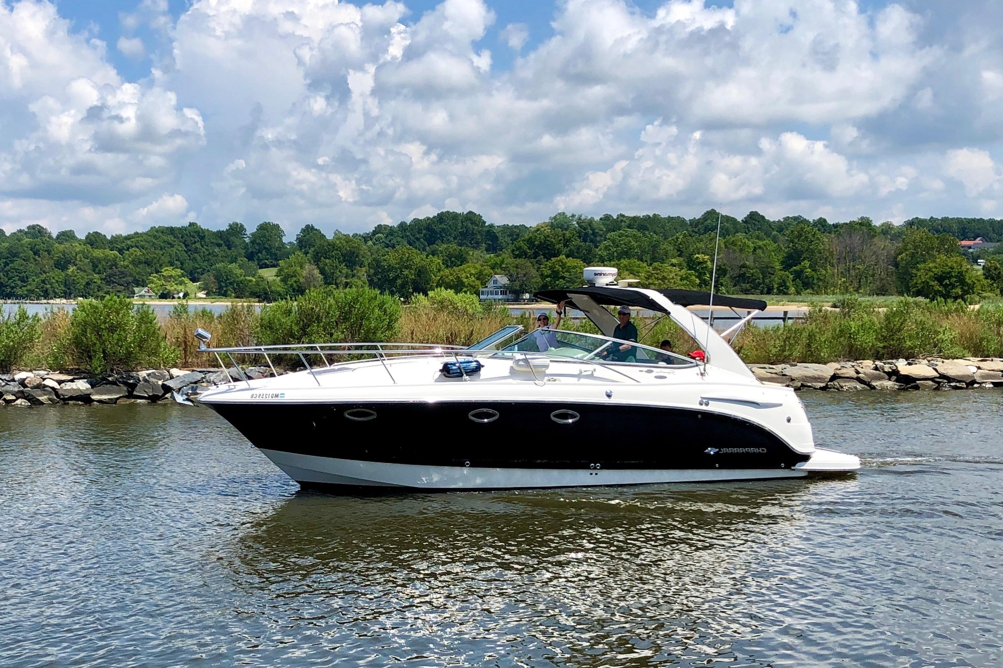 Chaparral 330 Signature 2007 Chaparral 330 Signature boat cruising on a scenic lake under a cloudy sky.