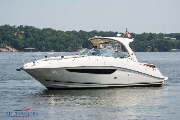 Sea Ray 370 Sundancer 2016 Sea Ray 370 Sundancer yacht on a serene lake.