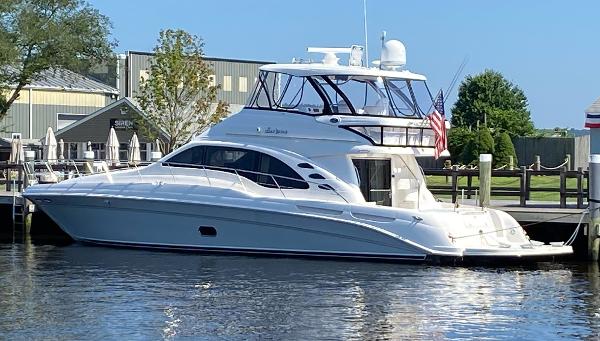 Sea Ray 58 Sedan Bridge 2006 Sea Ray 58 Sedan Bridge yacht docked at marina, clear sky background.