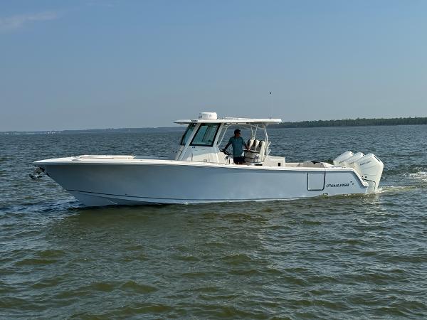 Sailfish 360 CC 2024 Sailfish 360 CC boat cruising on open water.