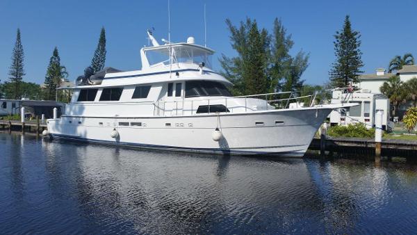 Hatteras 70 Cockpit Motor Yacht 1987 Hatteras 70 Cockpit Motor Yacht docked on a sunny day.