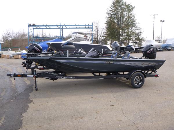 Ranger RT178 2024 Ranger RT178 boat on trailer, parked outdoors, side view.