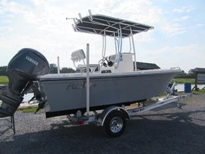 Parker 18SE Center Console 2024 Parker 18SE Center Console boat on trailer with Yamaha outboard motor.