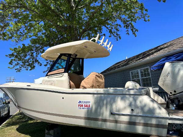 Chris-Craft Catalina 24 2023 Chris-Craft Catalina 24 boat for sale, parked outdoors under a tree.