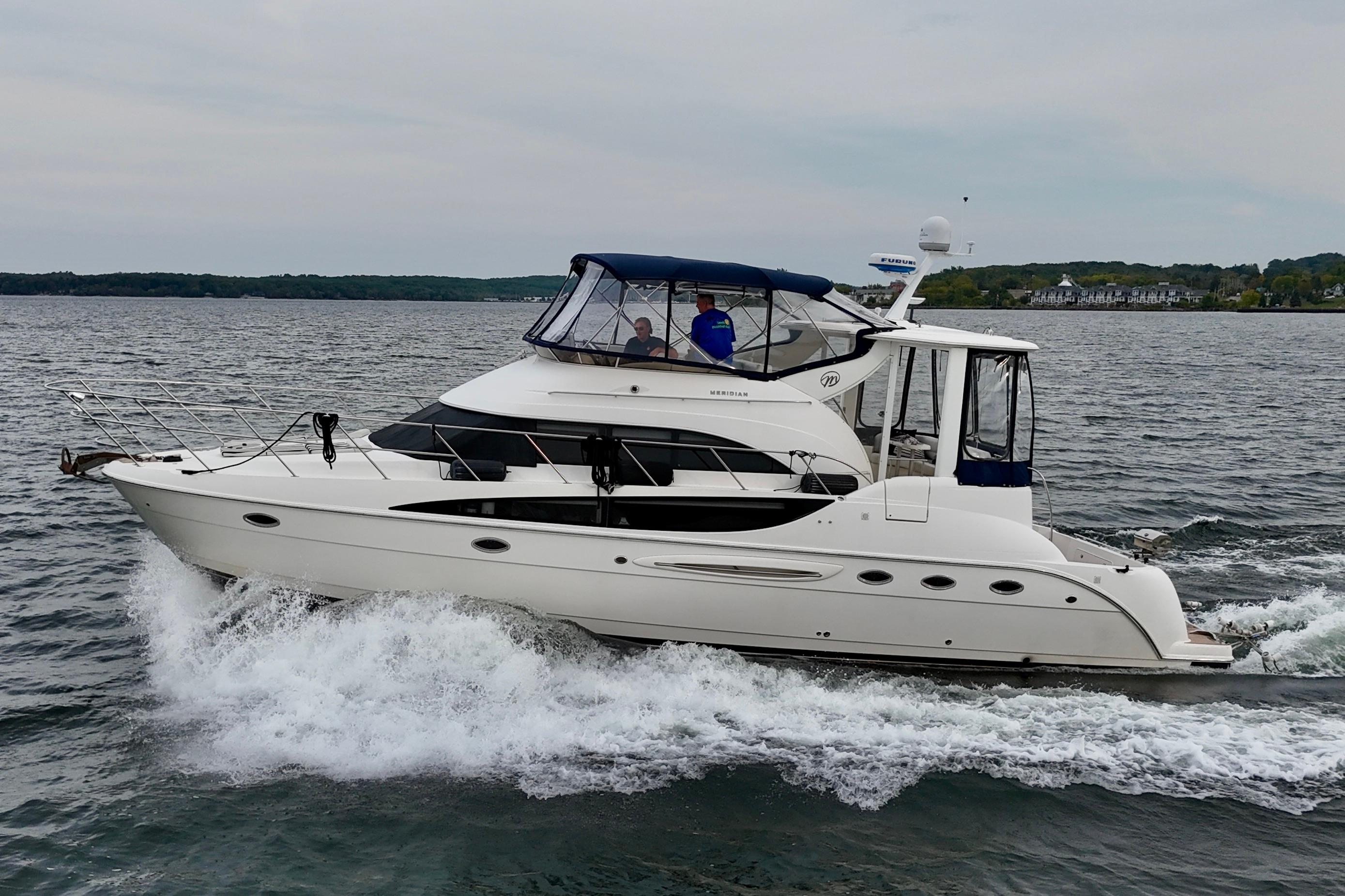 Meridian Motoryacht 2006 Meridian Motoryacht cruising on open water, side view.