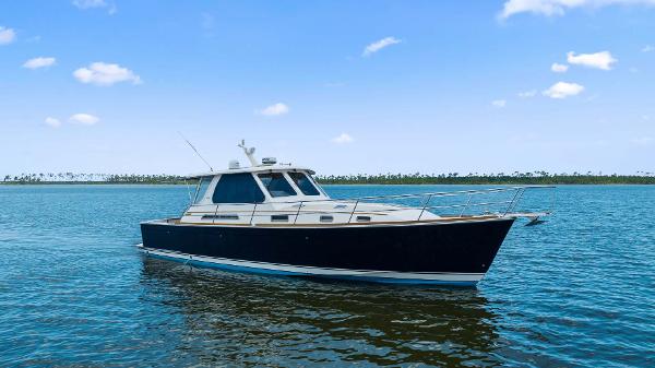 Sabre 42 Express 2005 Sabre 42 Express yacht on calm blue water under clear sky.