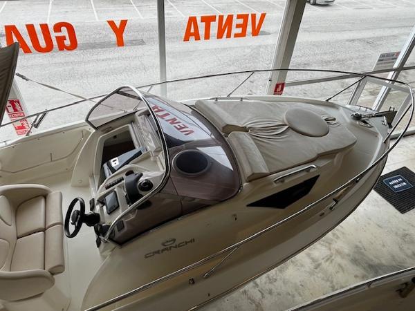Cranchi Endurance 30 2015 Cranchi Endurance 30 boat displayed in showroom, featuring sleek design and comfortable seating.