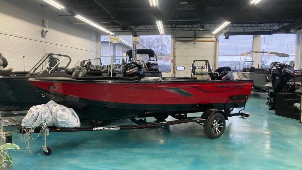 Crestliner 1650 Pro Tiller 2025 Crestliner 1650 Pro Tiller boat in showroom, red and black design.