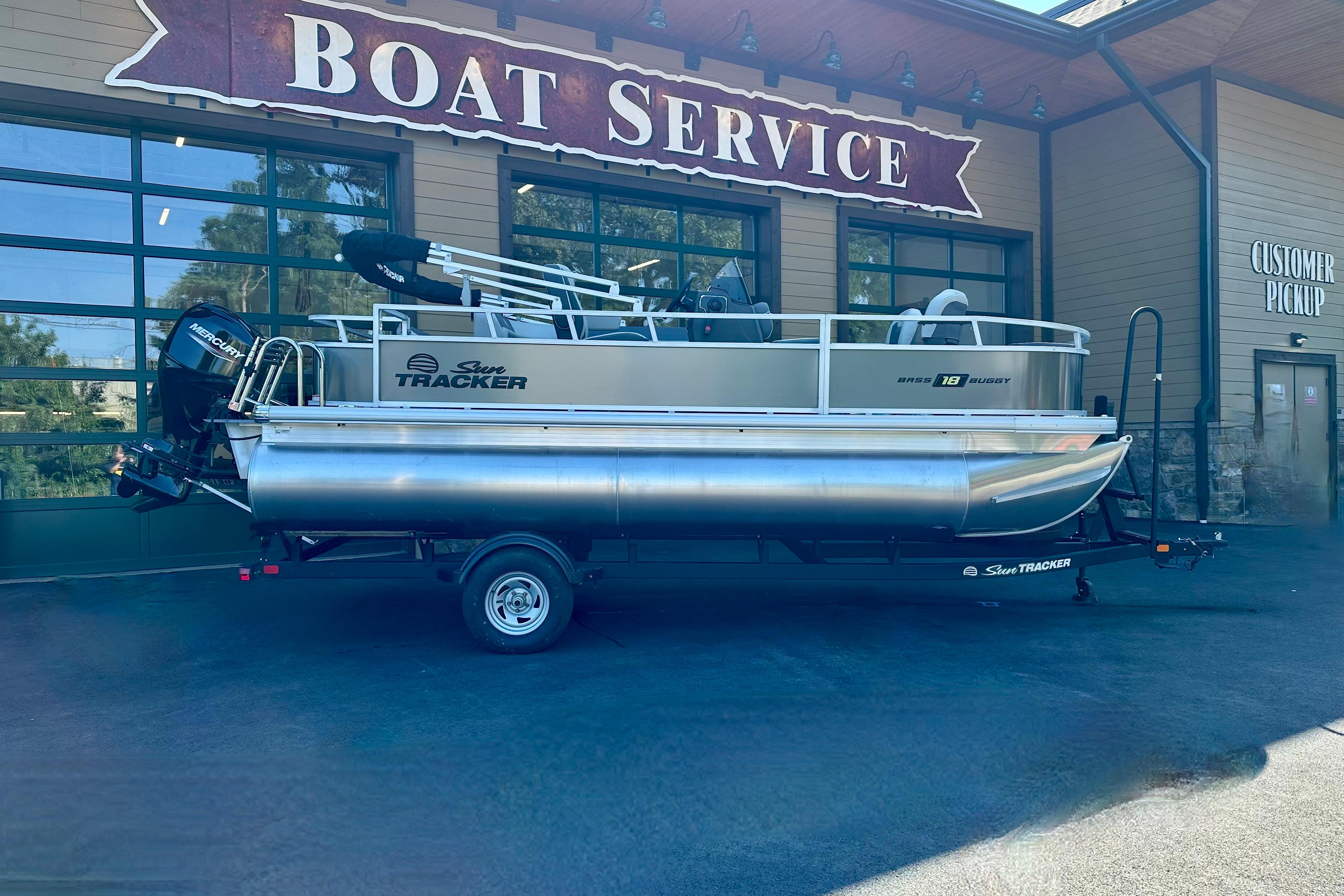 Sun Tracker Bass Buggy 18 DLX 2026 Sun Tracker Bass Buggy 18 DLX pontoon boat at boat service center.