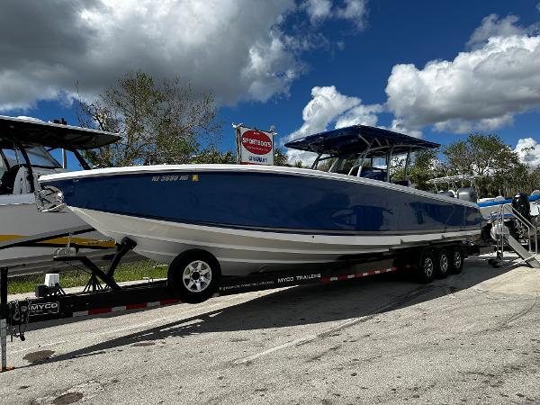 Nor-Tech 390 Center Console 2017 Nor-Tech 390 Center Console boat on trailer under cloudy sky.