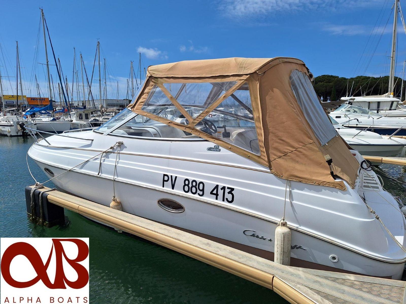 Chris-Craft Crowne 252 1996 Chris-Craft Crowne 25 boat docked at marina with tan canopy.