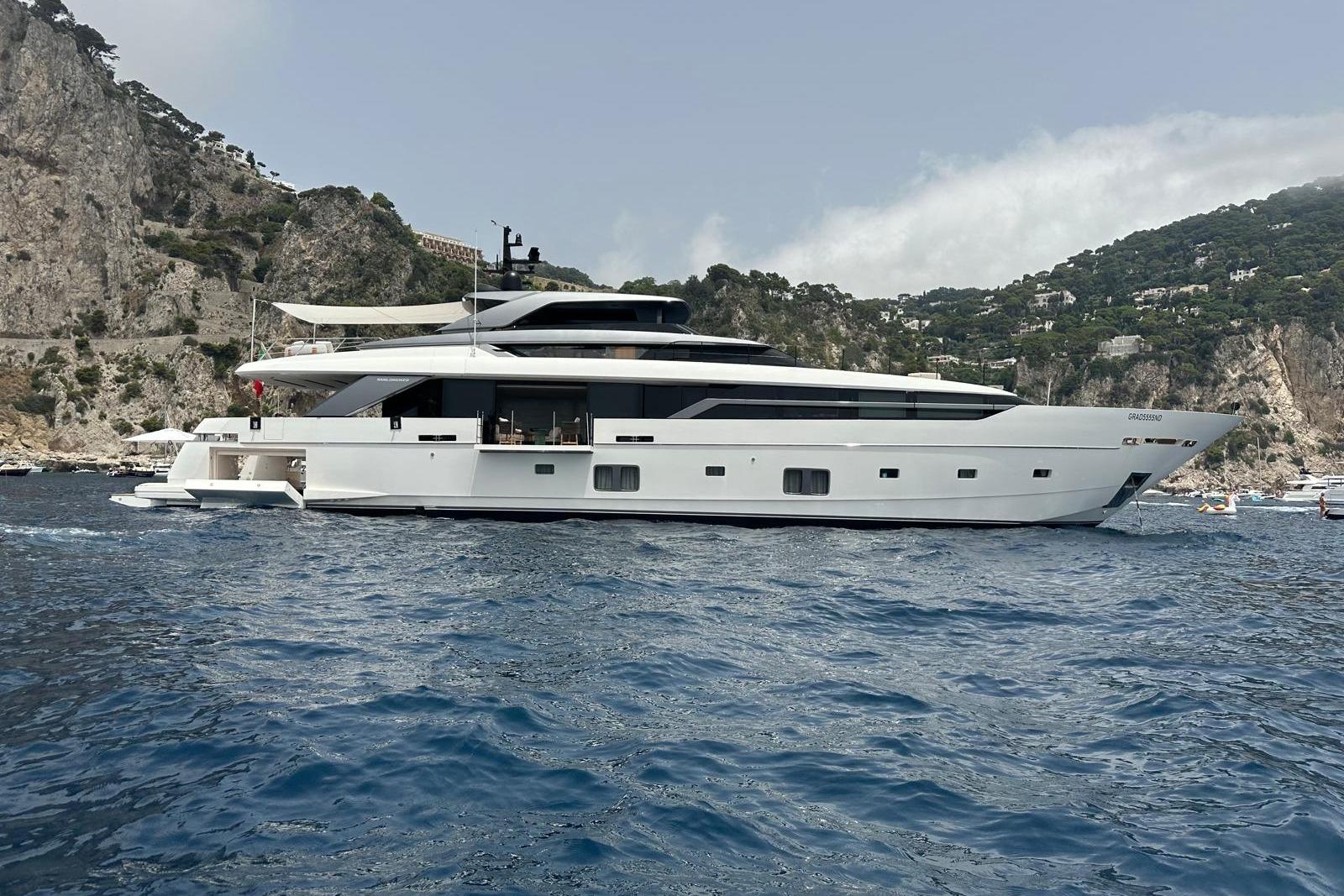 Sanlorenzo 120 ASYMMETRIC Luxury Sanlorenzo 120 Asymmetric yacht, 2023 model, cruising near rocky coastline.