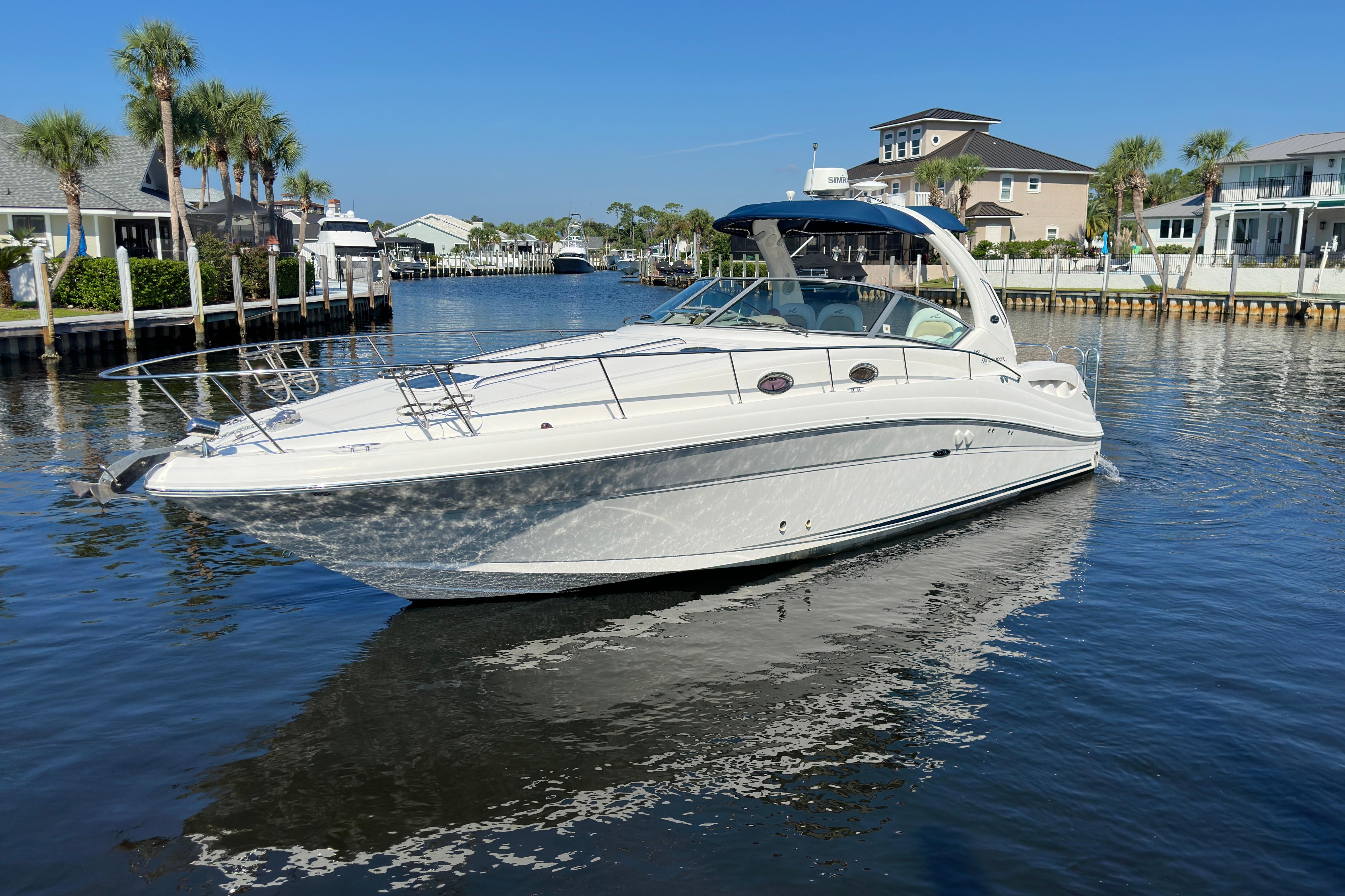 Sea Ray 340 Sundancer 2008 Sea Ray 340 Sundancer yacht cruising in a scenic waterfront area.