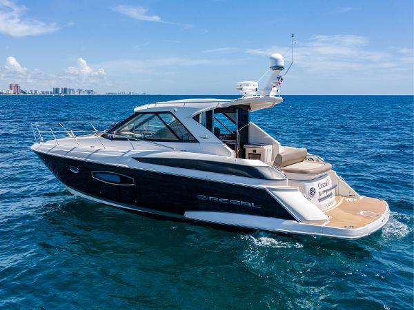 Regal 42 Sport Coupe 2015 Regal 42 Sport Coupe yacht cruising on open sea.