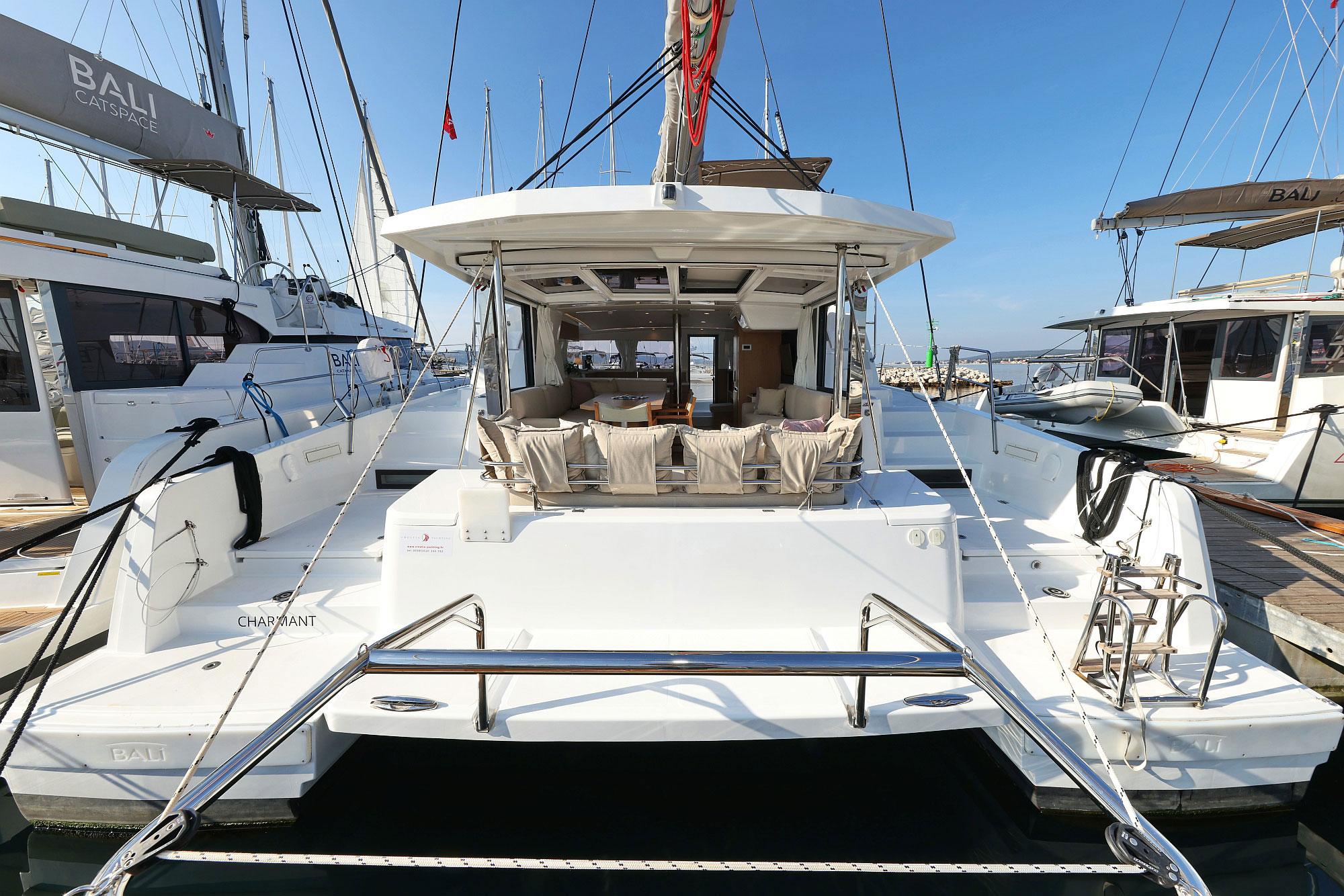 Bali 4.2 2024 Bali 4.2 catamaran docked at marina, showcasing spacious deck and modern design.