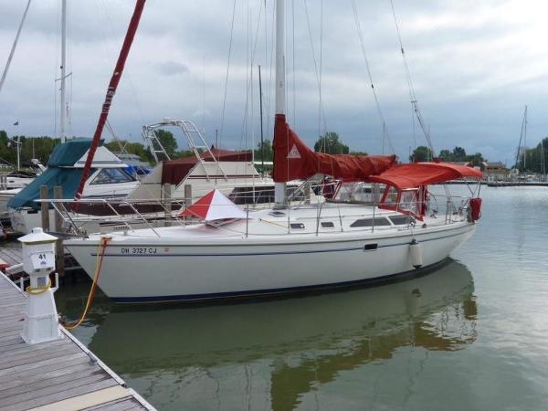 Catalina 36 Mark II 1999 Catalina 36 Mark II sailboat docked at a marina with red sail covers.