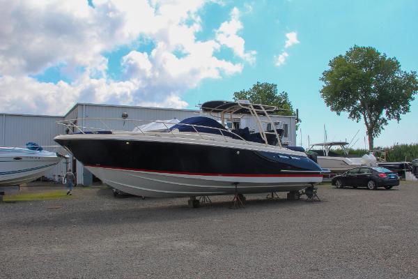 Chris-Craft Launch 36 2017 Chris-Craft Launch 36 boat on a trailer in a marina.