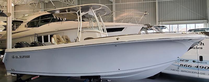 Sailfish 242 CC 2021 Sailfish 242 CC boat displayed in a showroom, side view.