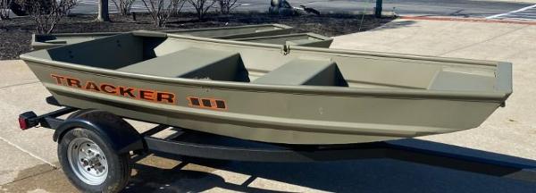 Tracker Grizzly 1036 Utility 2025 Tracker Grizzly 1036 Utility boat on trailer, parked outdoors.