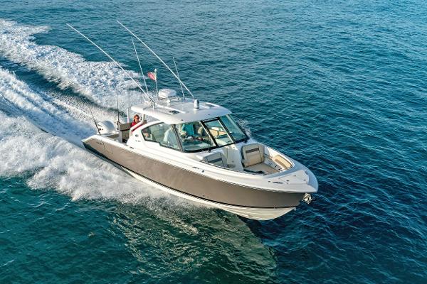 Pursuit DC 325 Dual Console 2019 Pursuit DC 325 Dual Console boat cruising on open water.