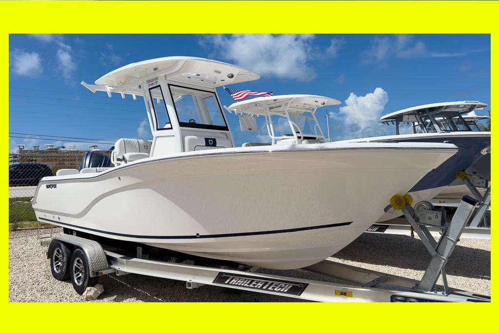 Sea Fox 248 Commander 2025 Sea Fox 248 Commander boat on trailer under blue sky.