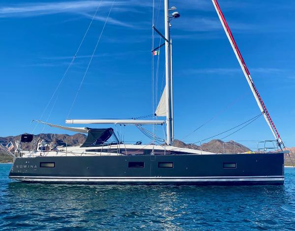 Jeanneau 54 2018 Jeanneau 54 sailboat on calm water with clear blue sky.