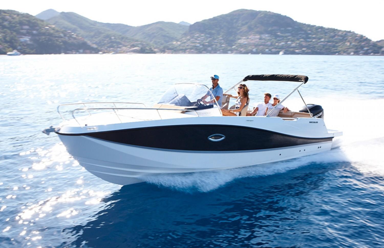 Quicksilver Activ 755 Sundeck 2023 Quicksilver Activ 755 Sundeck cruising on blue water with passengers onboard.