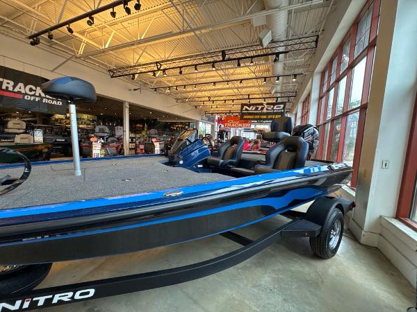 Nitro Z18 2025 Nitro Z18 boat displayed in a showroom with modern interior and sleek design.
