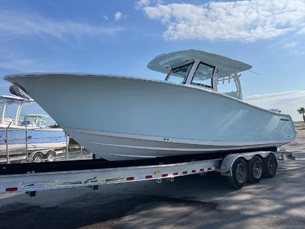 Sportsman Open 302 Center Console 2025 Sportsman Open 302 Center Console boat on a trailer under a blue sky.