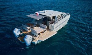 YOT 41 Modern YOT 41 boat cruising on open water, 2025 model, featuring dual engines and spacious deck.