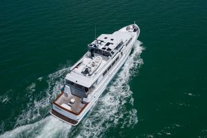 Broward 30.5 Aerial view of 1995 Broward 30.5 yacht cruising on open water.