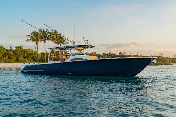 Valhalla Boatworks V-46 2025 Valhalla Boatworks 46 V-46 cruising near tropical shoreline at sunset.
