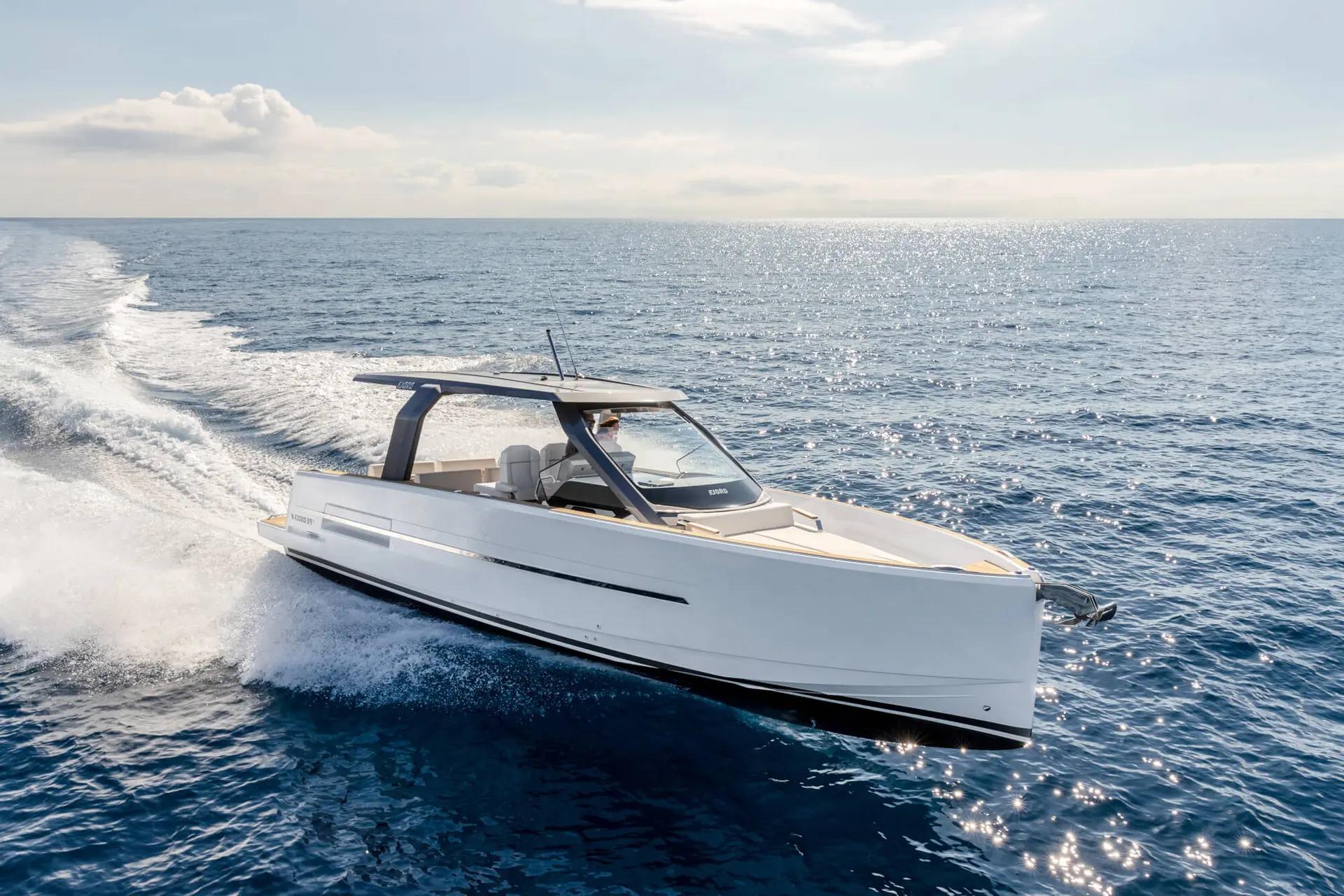 Fjord 39 XL 2026 Fjord 39 XL yacht cruising on open sea under clear sky.