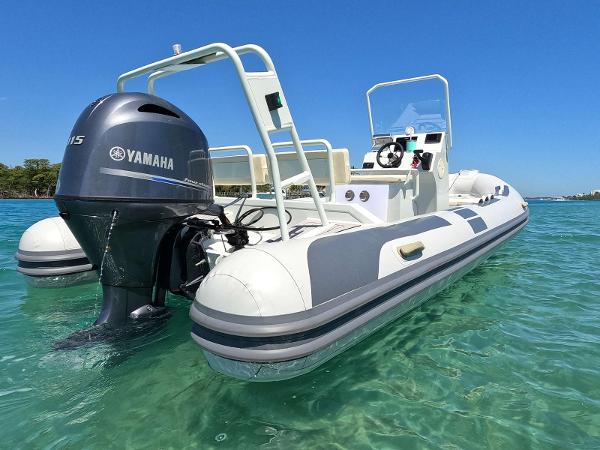 Rebo DL RIB 600 2024 Rebo DL RIB 600 boat with Yamaha engine on clear water.
