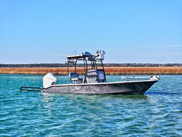 Xplor 24 Andros 2021 Xplor 24 Andros boat on calm water with clear blue sky.