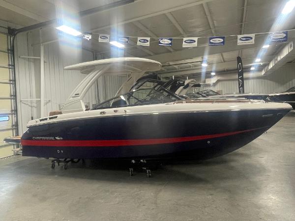 Chaparral 267 SSX 2025 Chaparral 267 SSX boat in showroom, side view.