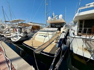 Princess V62 2011 Princess V62 yacht docked at marina, surrounded by other boats.