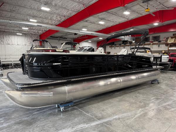Sylvan G-5 2025 Sylvan G-5 pontoon boat in showroom, featuring sleek black design and modern amenities.