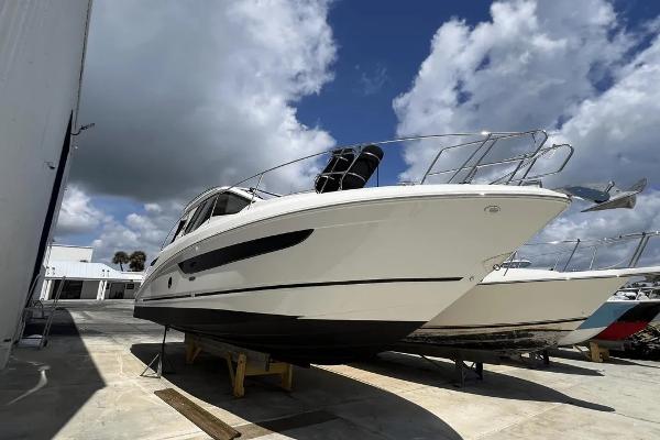 Sea Ray Sundancer 350 Coupe 2018 Sea Ray Sundancer 350 Coupe yacht on dry dock under cloudy sky.