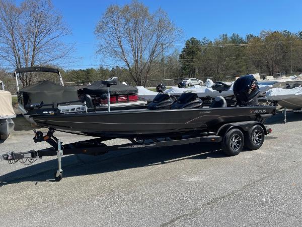 Vexus AVX 2080 2023 Vexus AVX 2080 boat on a trailer in a parking lot.