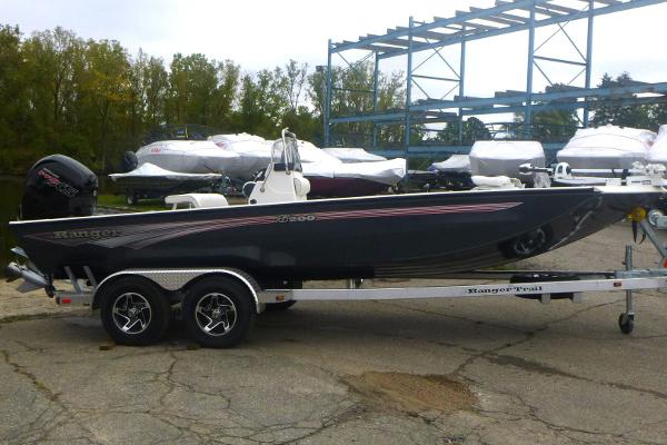 Ranger RB200 2024 Ranger RB200 boat on trailer, parked outdoors with other boats in the background.