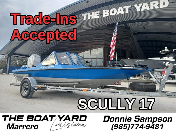Custom 17 Blue Scully 17 boat on trailer at The Boat Yard, Marrero; trade-ins accepted.
