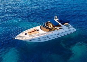 Princess V50 Luxurious 2002 Princess V50 yacht cruising on clear blue ocean waters.